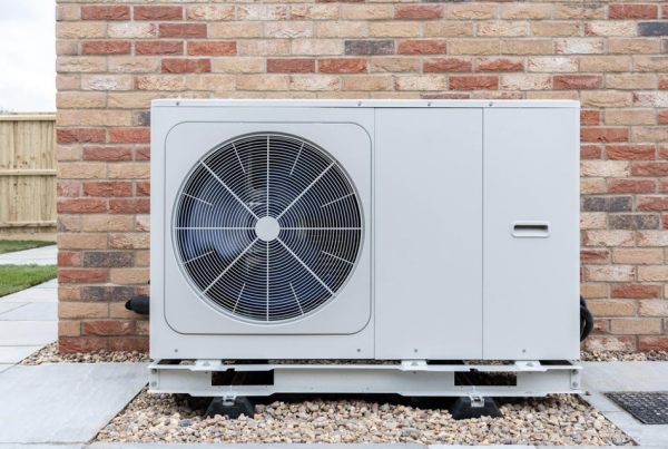 air-source heat pump | Heat pump in situ on the side of a house.